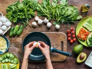 Feast Big; Stay Fit 18 Cooking 101, lady breaking egg on a pan while discussing basics of cooking